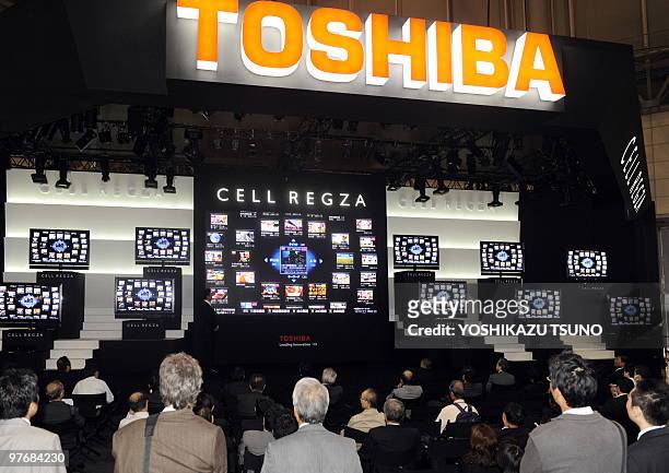 People look at Japanese electronics company Toshiba's innovative "Cell TV" at Asia's largest electronics trade show Ceatec in Chiba, suburban Tokyo...