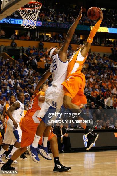 Prince of the Tennessee Volunteers drives to the basket for a dunk attempt against DeMarcus Cousins of the Kentucky Wildcats during the semirfinals...