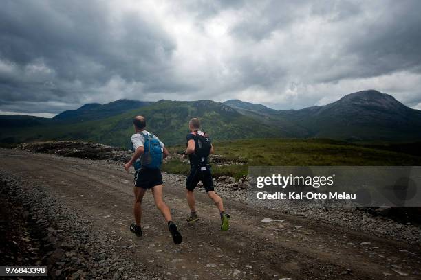 An athlete and his support on the runleg during the Celtman Extreme Triathlon on June 16, 2018 in Shieldaig, Scotland. Celtman is a part of the...