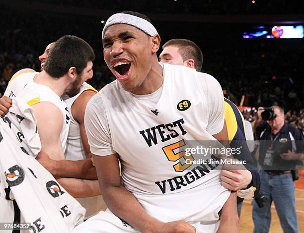 Kevin Jones of the West Virginia Mountaineers celebrates after defeating the Georgetown Hoyas during the championship of the 2010 NCAA Big East...