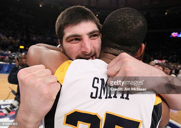 Deniz Kilicli and Wellington Smith of the West Virginia Mountaineers celebrate after defeating the Georgetown Hoyas during the championship of the...