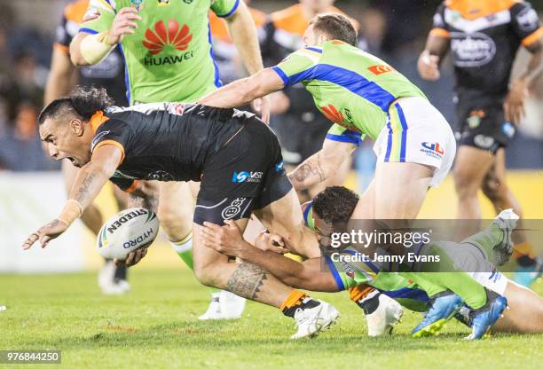 Make Fonua of the Tigers surges forward during the round 15 NRL match between the Wests Tigers and the Canberra Raiders at Campbelltown Sports...