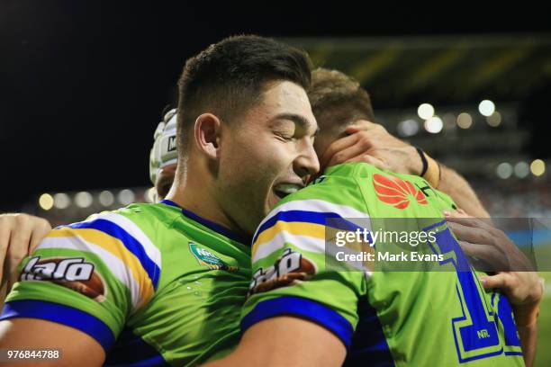 Nick Cotric of the Raiders celebrates a try with team mates during the round 15 NRL match between the Wests Tigers and the Canberra Raiders at...