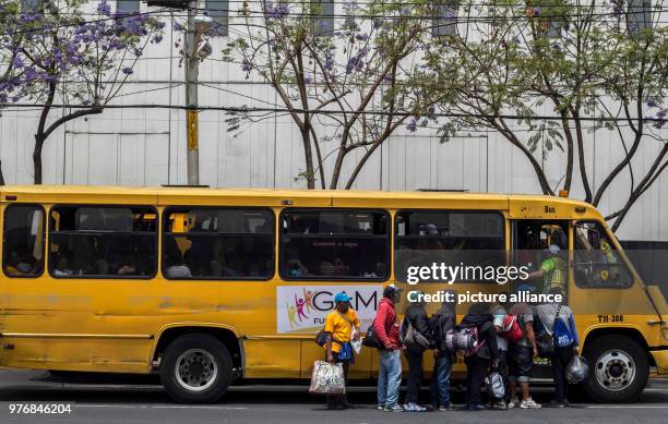 April 2018, Mexico, Mexico-City: A group of migrants board a local bus to train station near the capital city. Every year numerous migrants from...