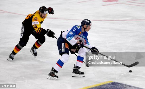 April 2018, Germany, Weisswasser: Ice hockey: International match, Germany vs Slovakia at the Eisarena Weisswasser. Germany's Stefan Loibl and...