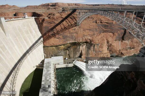 View of the water below the bridge. Water is released from the Glen Canyon Dam into the Colorado River below. The water and sand will replenish...