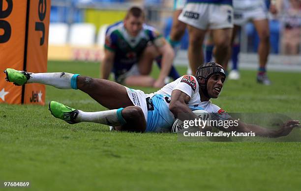 Preston Campbell of the Titans scores the match winning try during the round one NRL match between the Gold Coast Titans and the Warriors at Skilled...