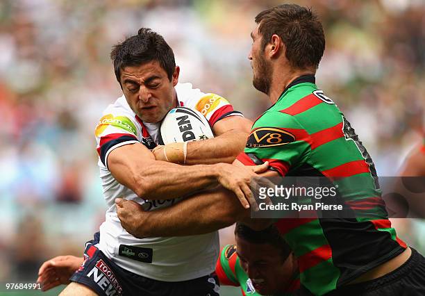 Anthony Minichiello of the Roosters is tackled by David Taylor of the Rabbitohs is tackled by during the round one NRL match between the South Sydney...