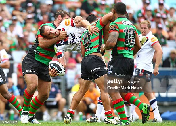 Nate Myles of the Roosters is tackled during the round one NRL match between the South Sydney Rabbitohs and the Sydney Roosters at ANZ Stadium on...