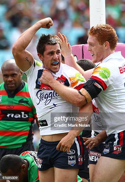 Mitchell Pearce of the Roosters celebrates his try during the round one NRL match between the South Sydney Rabbitohs and the Sydney Roosters at ANZ...