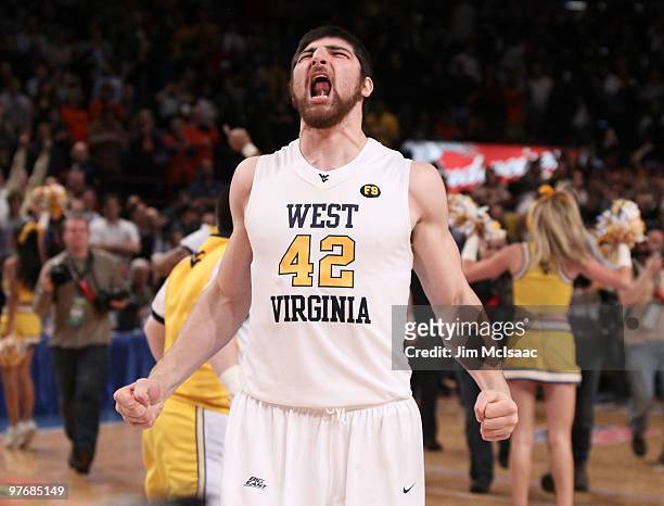 Deniz Kilicli of the West Virginia Mountaineers celebrates after defeating the Georgetown Hoyas during the championship of the 2010 NCAA Big East...