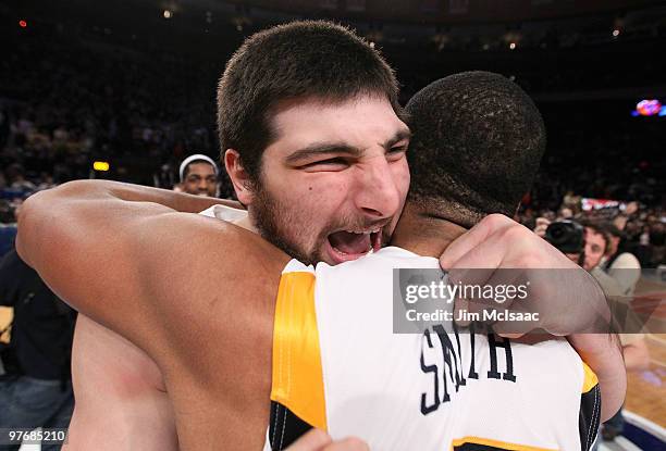 Deniz Kilicli and Wellington Smith of the West Virginia Mountaineers celebrate after defeating the Georgetown Hoyas during the championship of the...