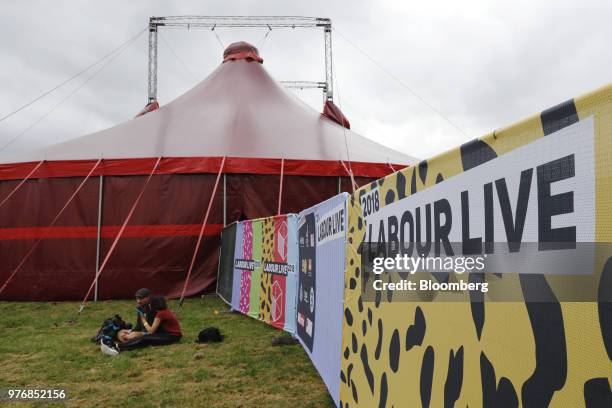 Attendees sit by the 'Solidarity Tent' during the 'Labour Live' festival in London, U.K., on Saturday, June 16, 2018. This weeks marathon Brexit...