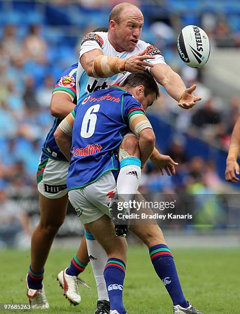 Luke Bailey of the Titans gets a pass away during the round one NRL match between the Gold Coast Titans and the Warriors at Skilled Park on March 14,...