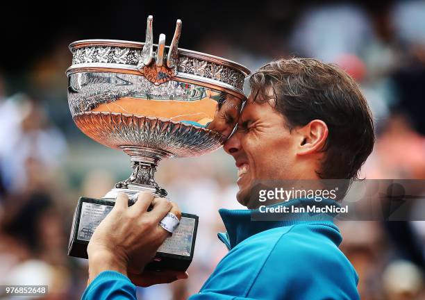 Rafael Nadal of Spain is seen with the trophy after his Men's Singles Final match against Dominic Thiem of Austria during day fiftteen of the 2018...