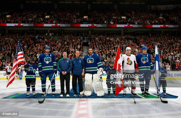 Ryan Kesler, Athletic Trainer Mike Burnstein, Equipment Manager Pat O'Neill, Roberto Luongo and Sami Salo of the Vancouver Canucks as well as Jarkko...