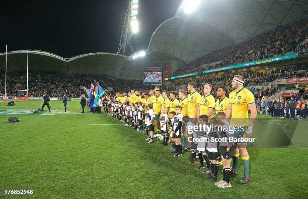 Michael Hooper and the Wallabies stand for the national anthem during the International test match between the Australian Wallabies and Ireland at...