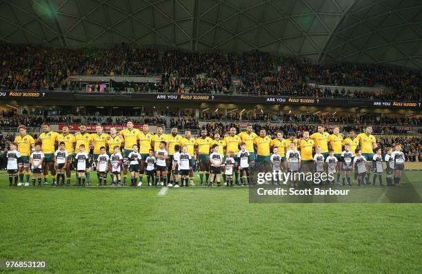 Michael Hooper and the Wallabies stand for the national anthem during the International test match between the Australian Wallabies and Ireland at...