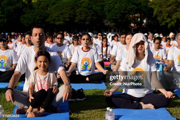 Thousands of people participate in a yoga exercise at Chulalongkorn University field, marking the International Day of Yoga in Bangkok, Thailand. 17...