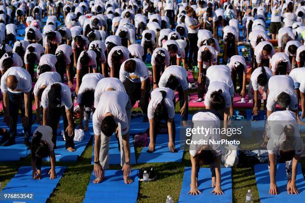 Thousands of people participate in a yoga exercise at Chulalongkorn University field, marking the International Day of Yoga in Bangkok, Thailand. 17...