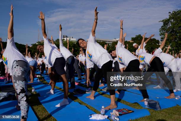 Thousands of people participate in a yoga exercise at Chulalongkorn University field, marking the International Day of Yoga in Bangkok, Thailand. 17...