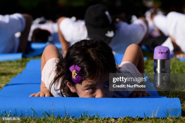 Girl participate in a yoga exercise at Chulalongkorn University field, marking the International Day of Yoga in Bangkok, Thailand. 17 June, 2018.