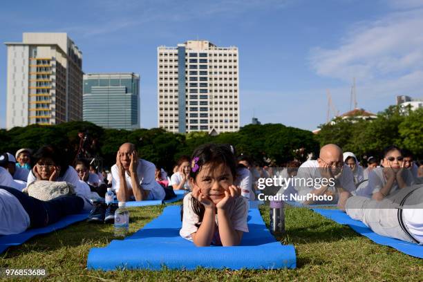 Girl participate in a yoga exercise at Chulalongkorn University field, marking the International Day of Yoga in Bangkok, Thailand. 17 June, 2018.