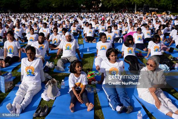 Thousands of people participate in a yoga exercise at Chulalongkorn University field, marking the International Day of Yoga in Bangkok, Thailand. 17...