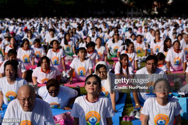 Thousands of people participate in a yoga exercise at Chulalongkorn University field, marking the International Day of Yoga in Bangkok, Thailand. 17...