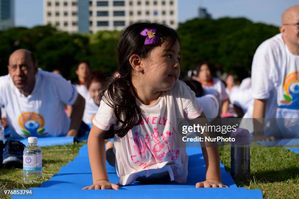 Girl participate in a yoga exercise at Chulalongkorn University field, marking the International Day of Yoga in Bangkok, Thailand. 17 June, 2018.