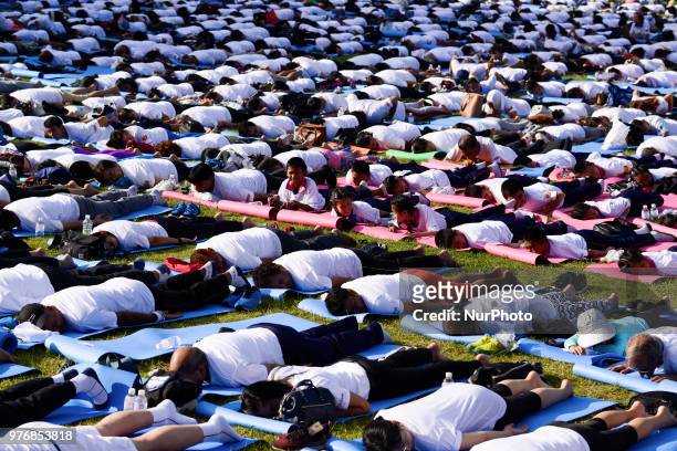 Thousands of people participate in a yoga exercise at Chulalongkorn University field, marking the International Day of Yoga in Bangkok, Thailand. 17...