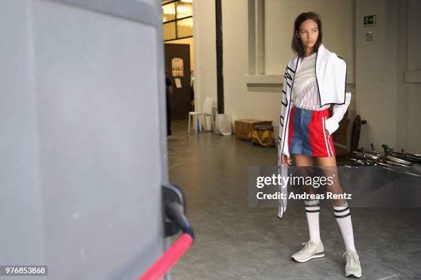 Model is seen backstage ahead of the Besfxxk show during Milan Men's Fashion Week Spring/Summer 2019 on June 17, 2018 in Milan, Italy.