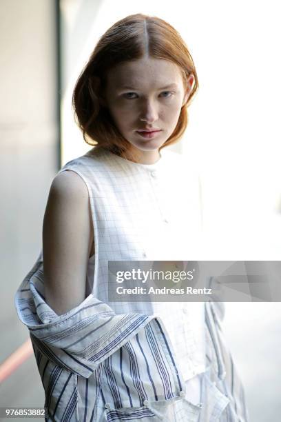 Model is seen backstage ahead of the Besfxxk show during Milan Men's Fashion Week Spring/Summer 2019 on June 17, 2018 in Milan, Italy.