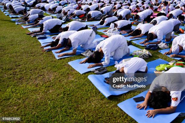 Thousands of people participate in a yoga exercise at Chulalongkorn University field, marking the International Day of Yoga in Bangkok, Thailand. 17...