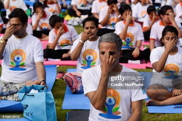 Thousands of people participate in a yoga exercise at Chulalongkorn University field, marking the International Day of Yoga in Bangkok, Thailand. 17...