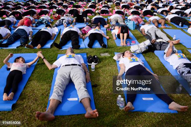 Thousands of people participate in a yoga exercise at Chulalongkorn University field, marking the International Day of Yoga in Bangkok, Thailand. 17...