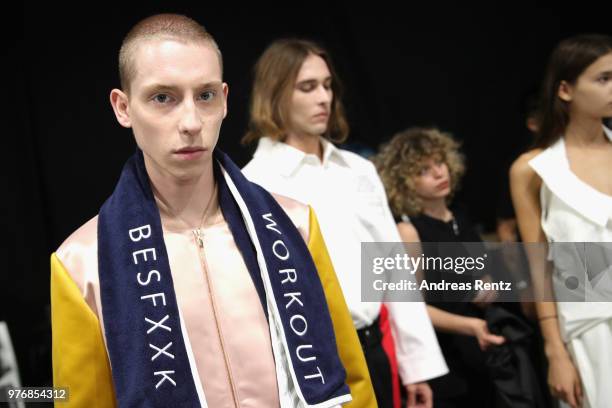 Model is seen backstage ahead of the Besfxxk show during Milan Men's Fashion Week Spring/Summer 2019 on June 17, 2018 in Milan, Italy.