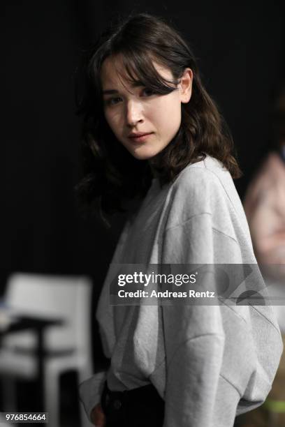 Model is seen backstage ahead of the Besfxxk show during Milan Men's Fashion Week Spring/Summer 2019 on June 17, 2018 in Milan, Italy.