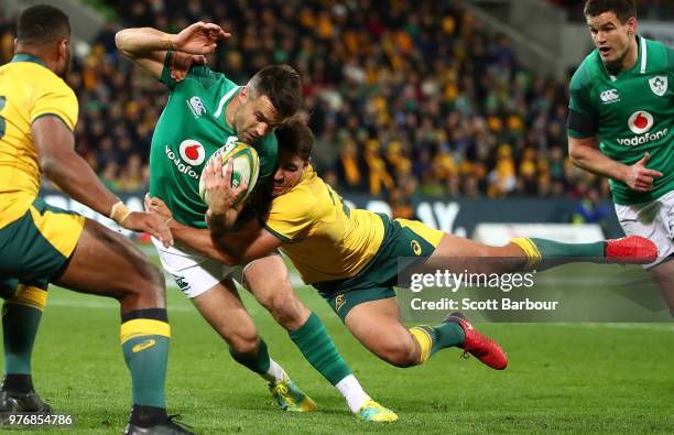 Conor Murray of Ireland is tackled by Nick Phipps of the Wallabies during the International test match between the Australian Wallabies and Ireland...