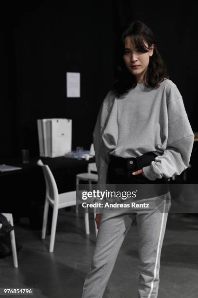 Model is seen backstage ahead of the Besfxxk show during Milan Men's Fashion Week Spring/Summer 2019 on June 17, 2018 in Milan, Italy.