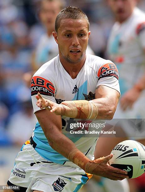 Scott Prince of the Titans passes the ball during the round one NRL match between the Gold Coast Titans and the Warriors at Skilled Park on March 14,...