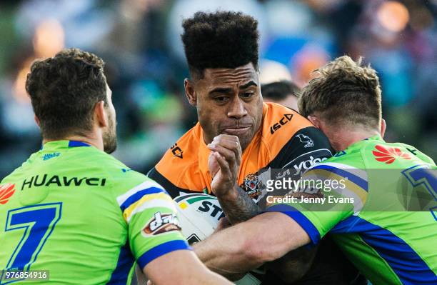 Kevin Naiqama of the Tigers surges forward during the round 15 NRL match between the Wests Tigers and the Canberra Raiders at Campbelltown Sports...