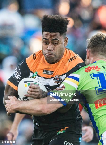 Kevin Naiqama of the Tigers runs with the ball during the round 15 NRL match between the Wests Tigers and the Canberra Raiders at Campbelltown Sports...