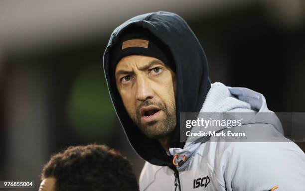 Benji Marshallof the Tigers looks on from the benchduring the round 15 NRL match between the Wests Tigers and the Canberra Raiders at Campbelltown...