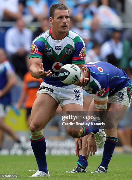 Brett Seymour of the Warriors passes the ball during the round one NRL match between the Gold Coast Titans and the Warriors at Skilled Park on March...