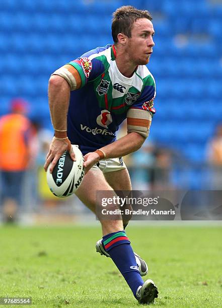 James Maloney of the Warriors passes the ball during the round one NRL match between the Gold Coast Titans and the Warriors at Skilled Park on March...