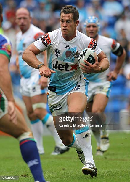Ashley Harrison of the Titans takes on the defence during the round one NRL match between the Gold Coast Titans and the Warriors at Skilled Park on...