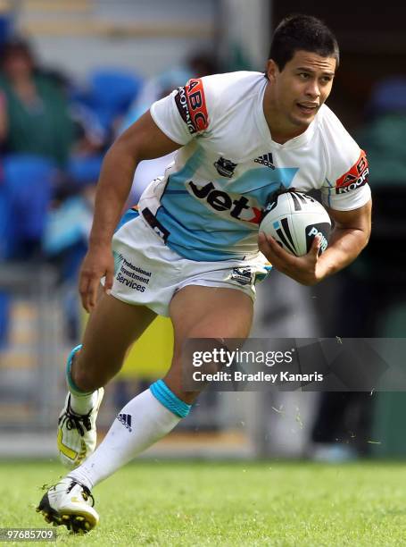 Kevin Gordon of the Titans runs with the ball during the round one NRL match between the Gold Coast Titans and the Warriors at Skilled Park on March...