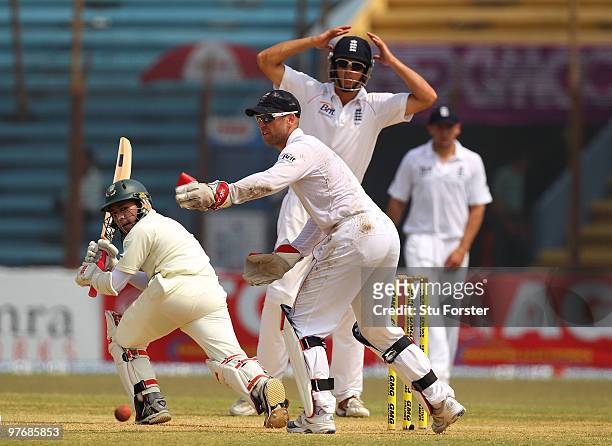 Bangladesh batsman Mushfiqur Rahim picks up some runs watched by Matt Prior and Alastair Cook during day three of the 1st Test match between...