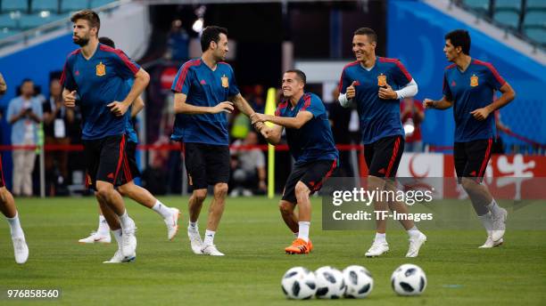 Sergio Busquets of Spain and Lucas Vazquez of Spain in action during a training session at Fisht Stadium on June 14, 2018 in Sochi, Russia.